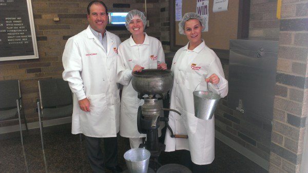 Matt of Prairie Farms, Cassandra and Olivia at their Hazelwood facility, with a nineteenth century butter churner!
